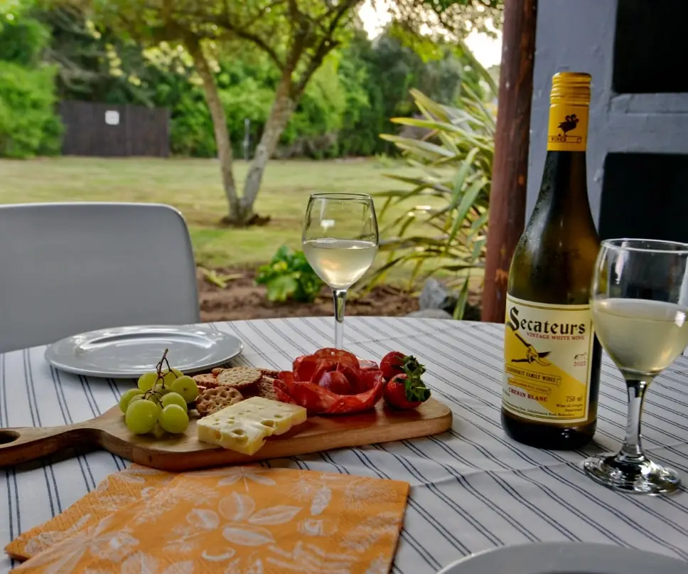 Snacks and wine on the patio looking into the gardens