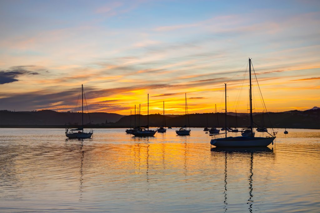 Knysna Lagoon waterfront with boats moored near Thesen Islands